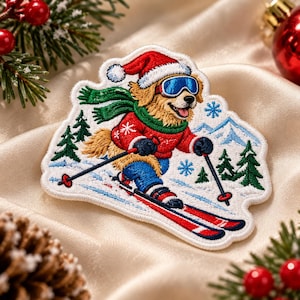 May include: An embroidered patch featuring a golden dog wearing a red Santa hat, blue ski goggles, a green scarf, and a red sweater while skiing on snow. The design includes green pine trees, blue mountains, and white snowflakes on a white background.