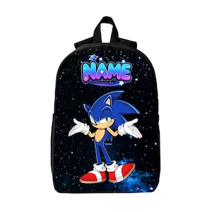 May include: A black backpack featuring a space-themed background with stars and a galaxy pattern. The front displays a graphic of the character Sonic the Hedgehog and the word NAME in a blue, purple, and white gradient font with a small planet icon.