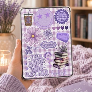 May include: A tablet case featuring a light purple gingham pattern covered in various stickers, including a smiley face, a coffee cup labeled Iced Coffee and Books, a flower, a stack of books, and text reading The Book Was Better and Book Addict.