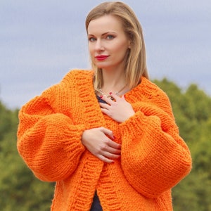 Hand knitted orange cardigan boutique sweater jacket by SuperTanya