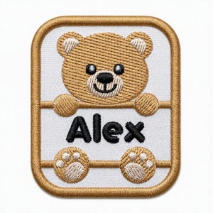May include: A rectangular embroidered patch featuring a tan teddy bear with black eyes and nose. The bear is positioned above the black embroidered name Alex, with its paws resting on a horizontal line. The patch has a white background and gold border.