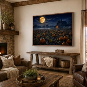 May include: A rectangular wall art print depicting a nighttime pumpkin patch under a large full moon. The scene features rows of orange pumpkins in a field, a dark barn structure in the background, and a deep blue sky with soft clouds and moonlight.