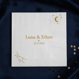 Personalized starry night celestial napkins with custom gold foil moon and stars. White paper cocktail beverage napkins for romantic wedding bar, twinkle little star baby shower, graduation, anniversary birthday party event table decor.