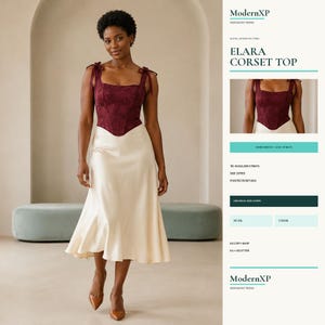 May include: A dark red corset top with tie-shoulder straps and a pointed front hem, paired with a cream-colored satin midi skirt. The text on the side reads ModernXP Sewing Patterns, Elara Corset Top, boned bodice, lace-up back, and size layers.