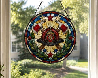 May include: A circular stained glass suncatcher featuring a central red firefighter helmet with a gold emblem, flanked by two crossed axes. The design includes green laurel leaves, red and blue stars, and a yellow sunburst pattern, suspended by a chain.