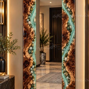 May include: A rectangular wall mirror featuring a frame crafted from natural wood with prominent knots and a glossy finish. The frame is accented by a river-like inlay of smooth, polished green and white stones set in translucent resin.
