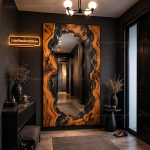 May include: A large rectangular wall mirror featuring a natural live-edge wood frame with dark resin accents. The mirror reflects a hallway and is mounted on a dark wall. A glowing sign with the text LukeHandicraftStore is visible on the wall.