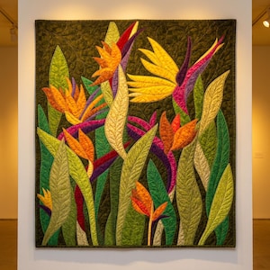 May include: A square fabric wall hanging featuring a quilted design of bird of paradise flowers in vibrant shades of orange, yellow, and purple, set against a dark olive green background with long, textured green leaves throughout the piece.