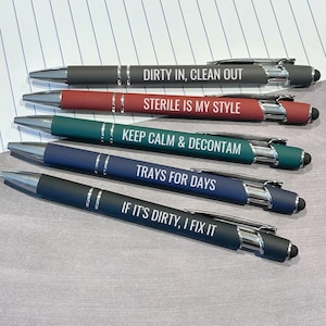 May include: A set of five retractable ballpoint pens with stylus tips, featuring matte barrels in gray, red, green, blue, and black. Each pen is printed with white text: DIRTY IN, CLEAN OUT, STERILE IS MY STYLE, KEEP CALM & DECONTAM, TRAYS FOR DAYS, and IF IT'S DIRTY, I FIX IT.