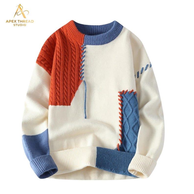 May include: A long-sleeve crewneck sweater featuring a color-blocked design in cream, burnt orange, and blue. The garment includes textured cable-knit panels, decorative whipstitch detailing, and ribbed cuffs and hem, with a blue collar.