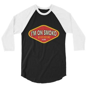 May include: Black and white raglan baseball shirt with a red and yellow diamond-shaped graphic. The graphic reads "I'M ON SMOKO SO LEAVE ME ALONE" in white text.