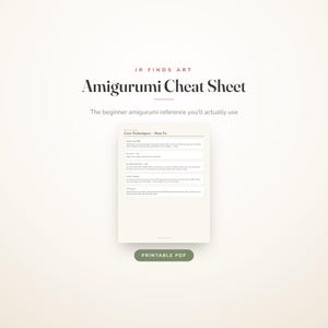 May include: A digital document titled JR FINDS ART Amigurumi Cheat Sheet, featuring a section on Core Techniques with instructions for magic ring, increases, invisible decreases, color change, and closing up, with a green PRINTABLE PDF button.