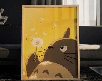May include: A framed vertical art print featuring a brown, furry, large-eared creature holding a white dandelion. The background is a solid, warm yellow color with several white dandelion seeds floating in the air around the creature.
