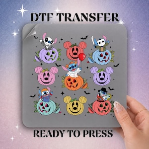 May include: A DTF transfer sheet featuring a grid of nine Halloween-themed illustrations. The design includes various Stitch characters dressed in costumes sitting on colorful jack-o'-lanterns, interspersed with bats and stars on a gray background.