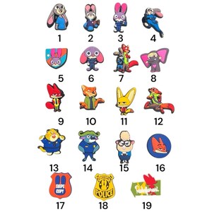 May include: A collection of nineteen colorful rubber shoe charms featuring various animated characters and symbols from Zootopia, including rabbits, foxes, and police badges, each numbered from one to nineteen for identification purposes.