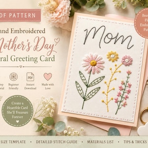 May include: A PDF pattern for a hand-embroidered Mother's Day floral greeting card. The card features the word Mom in black script above embroidered pink, yellow, and white flowers with green stems and leaves on a white fabric background.