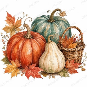 Könnte beinhalten: Eine Aquarellillustration mit einem großen orangefarbenen Kürbis, einem blaugrünen Kürbis und einem cremefarbenen Zierkürbis. Ein geflochtener Weidenkorb mit orangefarbenen und braunen Herbstblättern steht daneben, umgeben von Ahornblättern und Zweigen.