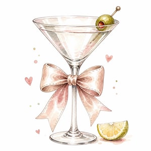 Op de afbeelding: Een helder glazen martini-glas met een grote, lichtroze decoratieve strik om de steel gebonden. Het glas bevat een groene olijf op een cocktailprikker en wordt vergezeld door een geel citruspartje en kleine roze hartjes.