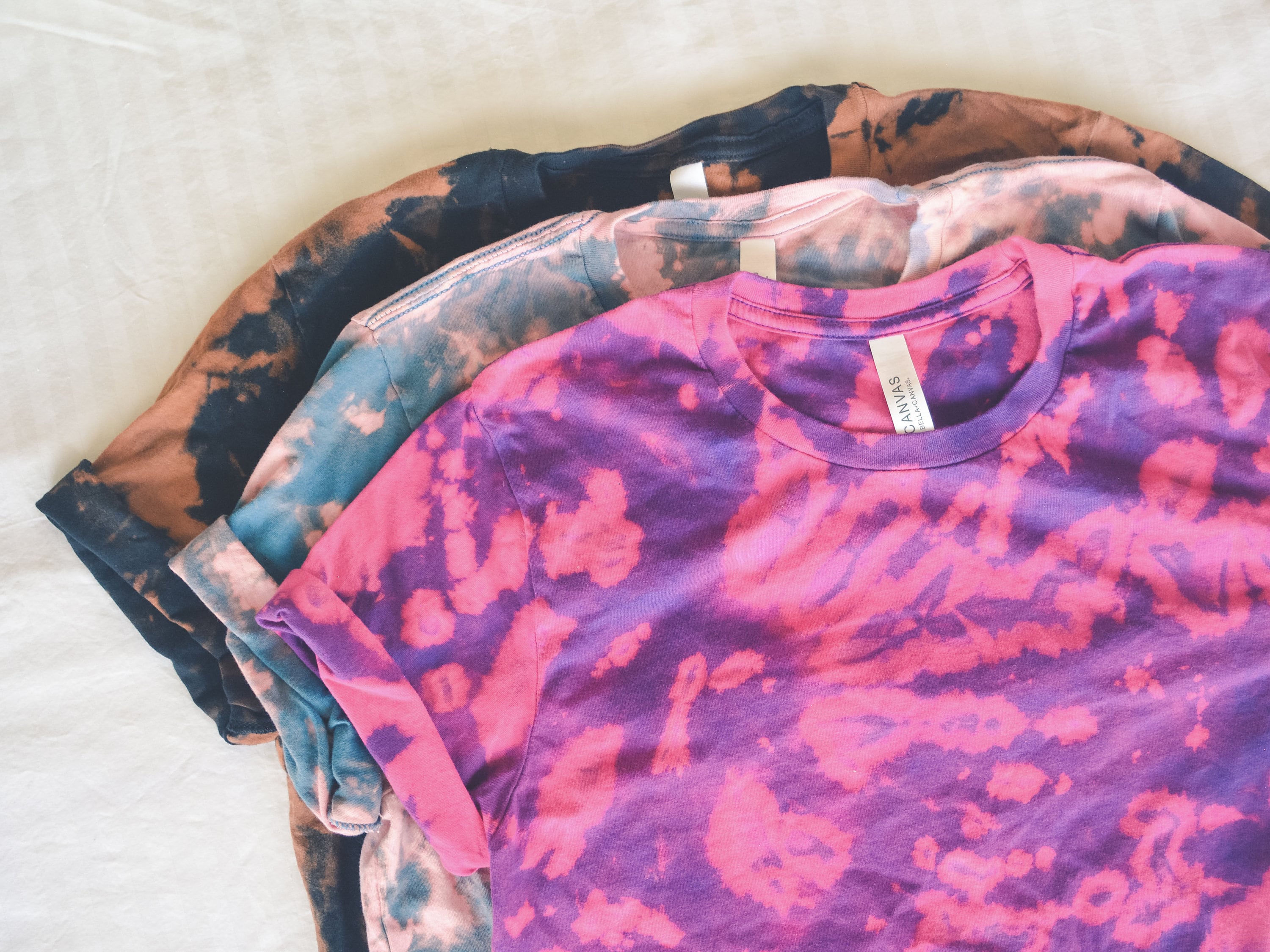 reverse tie dye purple shirt