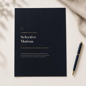 May include: A dark navy blue document titled A COMMUNICATION TOOLKIT Selective Mutism, with the subtitle For the child whose voice needs safety, not pressure. Below is a description of the toolkit. A dark blue pen rests beside the document.