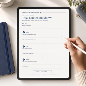 May include: A digital tablet displaying a Task Launch Builder template with sections for Ready, Cue, and Move. The screen features dark blue text on a light background, including prompts like What am I trying to begin and What needs to be in place before I begin.