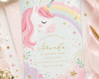 May include: A rectangular birthday invitation card featuring a white unicorn with a pink mane and a multi-colored horn. The background includes a pastel rainbow, clouds, and gold stars. Text reads: ITS A MAGICAL DAY Amanda IS TURNING FOUR! On April 12th at 2pm At 123 anywhere st., any city, st 12345 RSVP to 123-456-7890.