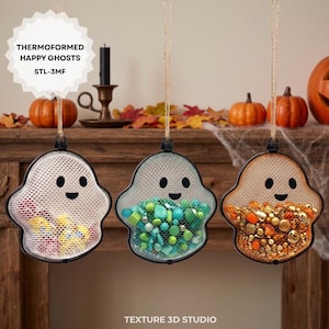 May include: Three ghost-shaped hanging containers made of white mesh with black facial features. Each container is filled with different items: the first with colorful small objects, the second with green beads, and the third with orange and gold beads.