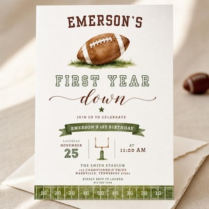 May include: A white birthday invitation card featuring a brown football illustration, green grass, and text reading Emerson's First Year down. The design includes a green banner, a goalpost graphic, and a football field yard line border at the bottom.