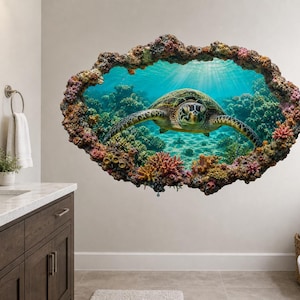 May include: A wall decal featuring a three-dimensional illusion of an underwater scene. A sea turtle swims through clear blue water surrounded by a vibrant coral reef. The design is framed by a textured, rocky border that creates a window effect.