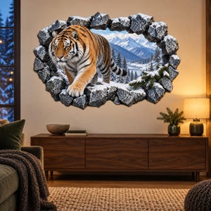 May include: A wall decal featuring a 3D-style hole in a stone wall, revealing a snowy mountain landscape with pine trees and a tiger walking forward. The tiger has orange fur with black stripes, and the surrounding rocks are grey and textured.