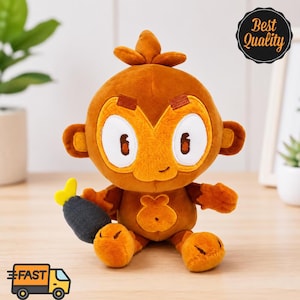 May include: A plush monkey toy with brown fur, large white eyes, and a small smile. The monkey holds a dark gray, fish-shaped object with a yellow tail. A black circular badge in the corner displays the text Best Quality in white script.