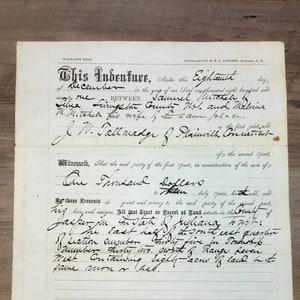 May include: An aged document titled "This Indenture" with handwritten text. The paper is folded and shows signs of wear, with visible creases and age spots. The document appears to be a legal or historical record.