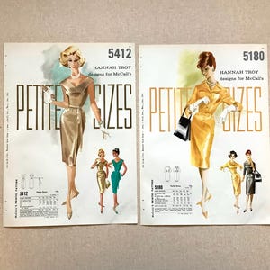 May include: Two vintage McCall's sewing pattern envelopes, numbers 5412 and 5180, featuring Hannah Troy designs for petite sizes. The illustrations show women in gold and yellow dresses with white gloves, including technical sketches and size charts.