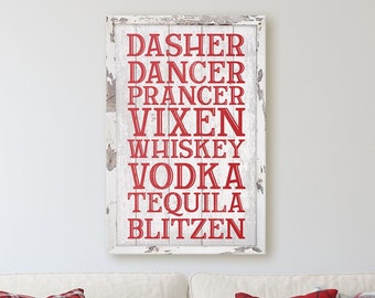 May include: White wooden sign with red text that reads "Dasher Dancer Prancer Vixen Whiskey Vodka Tequila Blitzen".