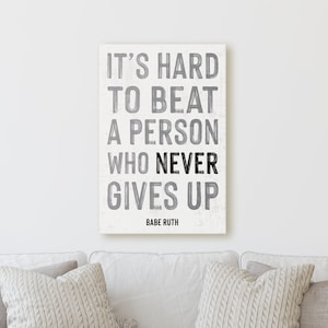 It&#39;s Hard To Beat A Person Who Never Gives Up | Sign Work Office Inspiration Wall Decor Canvas Print