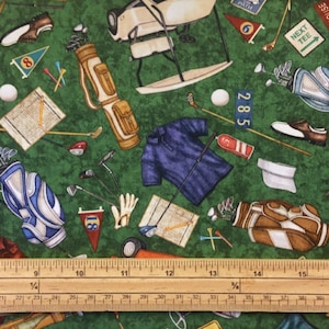 May include: A green fabric with a repeating pattern of golf-themed illustrations. The pattern includes golf clubs, golf bags, golf balls, golf carts, and a golf scorecard. The fabric also includes the text "Next Tee" and "Path 6".