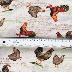 May include: A white fabric with a repeating pattern of brown, white, and red roosters and hens. The fabric has a vintage look with handwritten text in French and a stamp that says "Paris".
