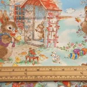 May include: A colourful illustration of a bunny rabbit holding a basket of Easter eggs in front of a small cottage with a pink trellis. The scene is set in a garden with flowers and butterflies.