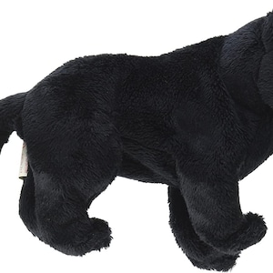 May include: Black plush panther toy with a soft, furry texture. The toy has a realistic appearance with a black body and a black tail.