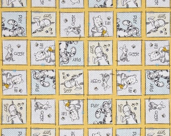 May include: A yellow fabric with a repeating pattern of Winnie the Pooh characters. Each square features a different Pooh character with a different activity, such as playing, sleeping, eating, or giggling. The text "Play", "Sleep", "Eat", and "Giggle" is repeated throughout the fabric.