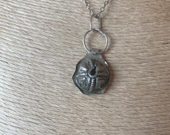 Yemen bead sawed in half as a pendant