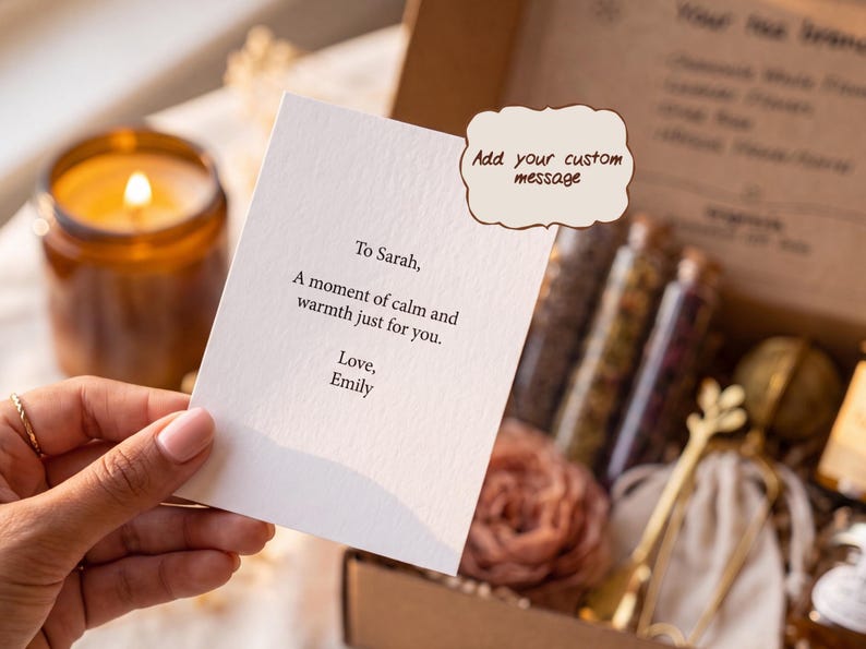 May include: A white rectangular card with black printed text that reads: To Sarah, A moment of calm and warmth just for you. Love, Emily. A brown speech bubble graphic with the text Add your custom message is positioned above the card.