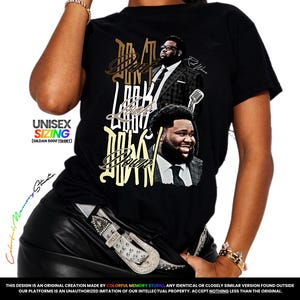 May include: A black t-shirt featuring a graphic print with the text "DON'T LOOK DOWN" in a stylized font. The design includes two photographic portraits of a man in a suit and tie, along with a microphone illustration. The shirt has short sleeves.