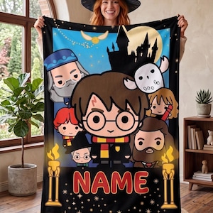 May include: A rectangular fleece blanket featuring a colorful cartoon illustration of various characters from a fantasy series, including a central boy with glasses, a white owl, and a castle silhouette. The word NAME is printed in large red letters.