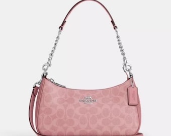 Bolsa de ombro feminina Coach Vintage rosa - Bolsa pequena e elegante com alça de corrente prateada.