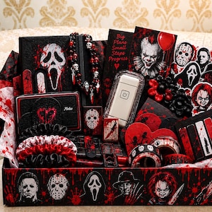 May include: A horror-themed gift box filled with items featuring iconic movie villains, including a notebook with a Ghostface mask, a beaded necklace, a lighter, a white power bank, and various stickers. The box is decorated with blood splatter patterns.