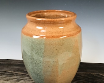Medium vase in nutmeg brown and green, paddled sides