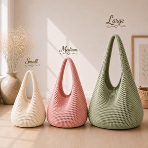 May include: Three crochet hobo bags in small, medium, and large sizes. The small bag is cream, the medium bag is pink, and the large bag is sage green. Each bag features a single integrated handle and a textured, woven stitch pattern.
