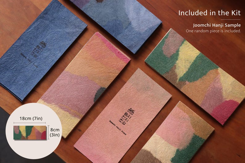 May include: Rectangular Joomchi Hanji paper sheets with textured surfaces in various colors including blue, pink, green, and yellow. Text reads Included in the Kit, Joomchi Hanji Sample, One random piece is included. Dimensions are 7 inches by 3 inches.