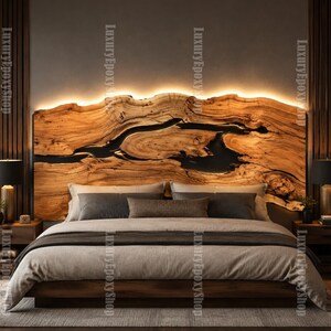 May include: A live edge wood headboard featuring a dark resin inlay and integrated warm LED backlighting. The headboard is positioned behind a bed with grey bedding, flanked by two wooden nightstands with black lamps. Text reads LuxuryEpoxyShop.